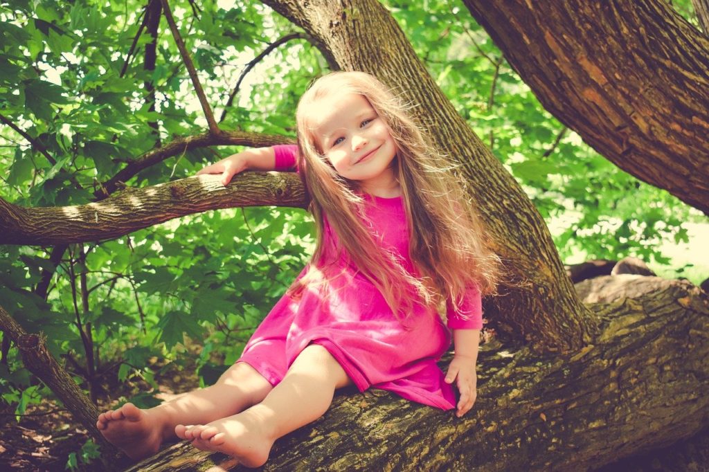 girl in tree, measles, vaccines