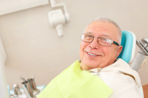 Mantachie dental care; man in dentist chair